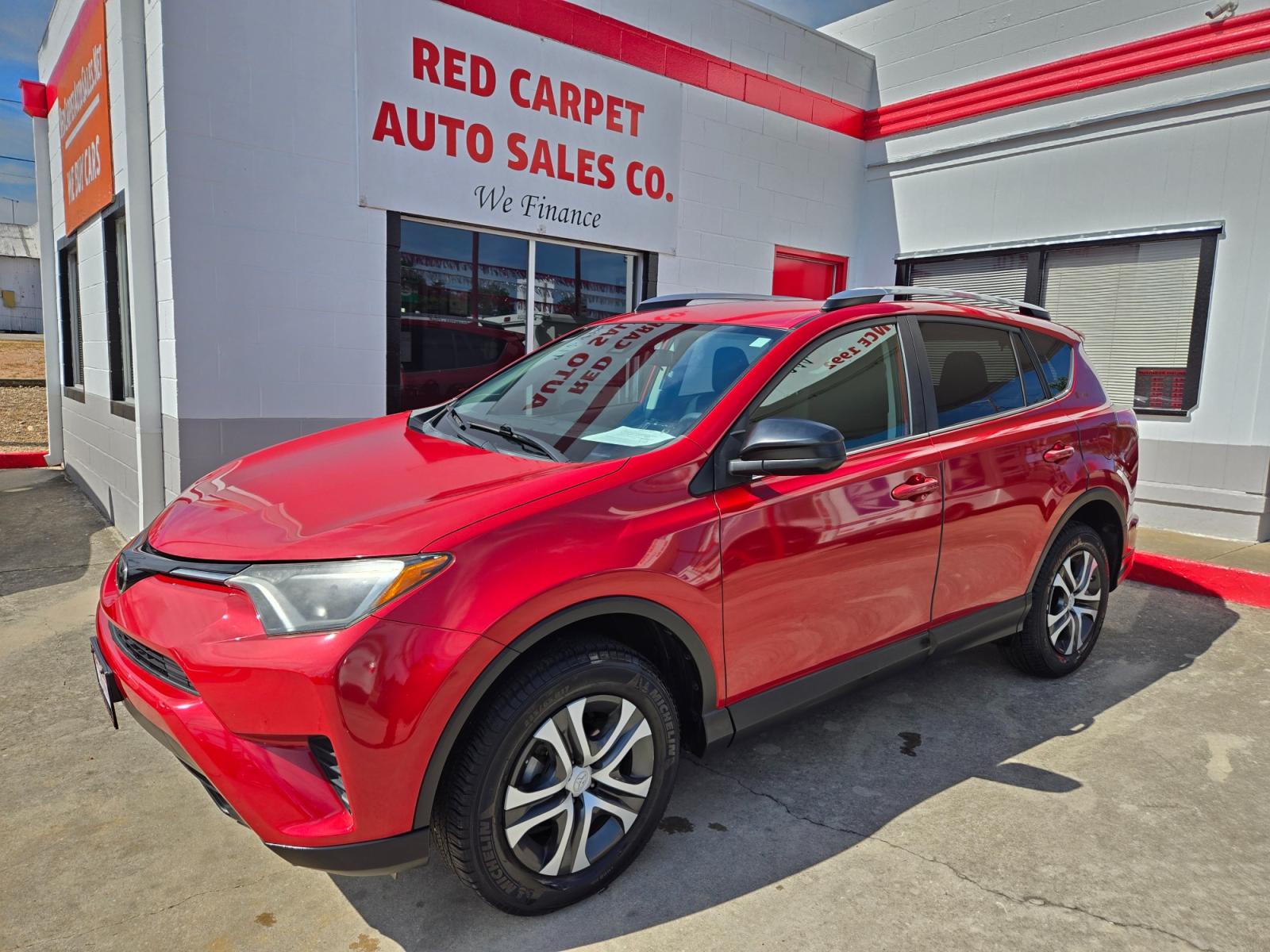 2017 Red Toyota RAV4 LE FWD (2T3ZFREV9HW) with an 2.5L L4 DOHC 16V engine, 6A transmission, located at 503 West Court, Seguin, TX, 78155, (830) 379-3373, 29.568621, -97.969803 - Photo #0